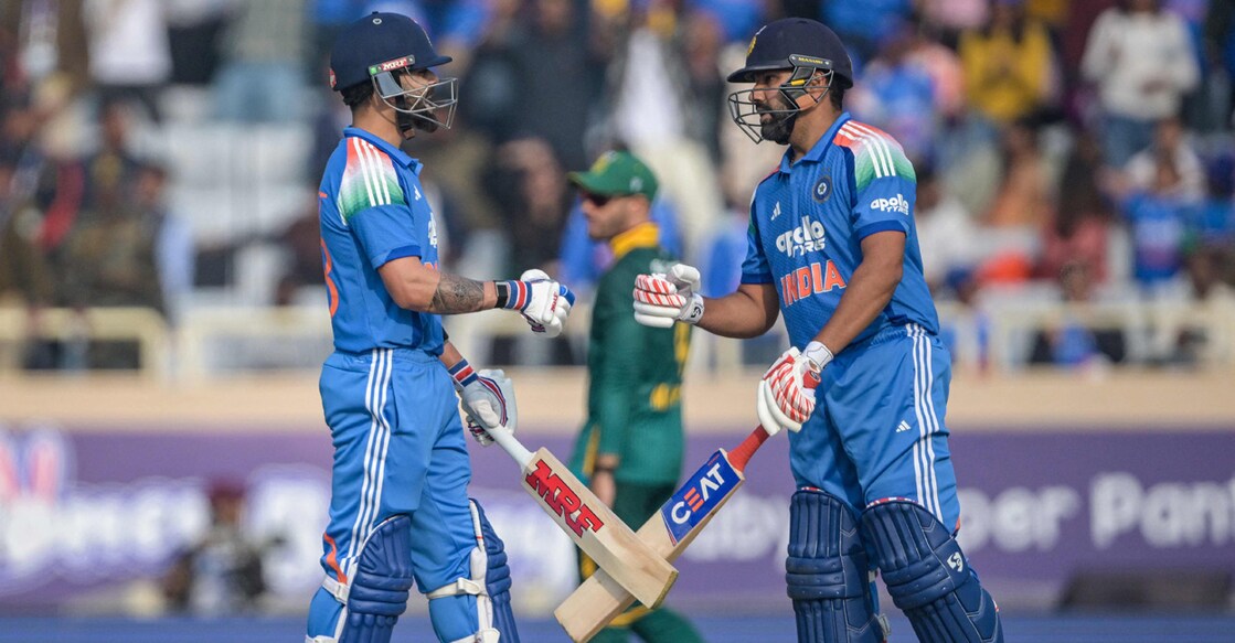 India's Virat Kohli and Rohit Sharma bump their fists during the first ODI against South Africa at the JSCA International Stadium in Ranchi on November 30, 2025. Photo: AFP/ Dibyangshu Sarkar