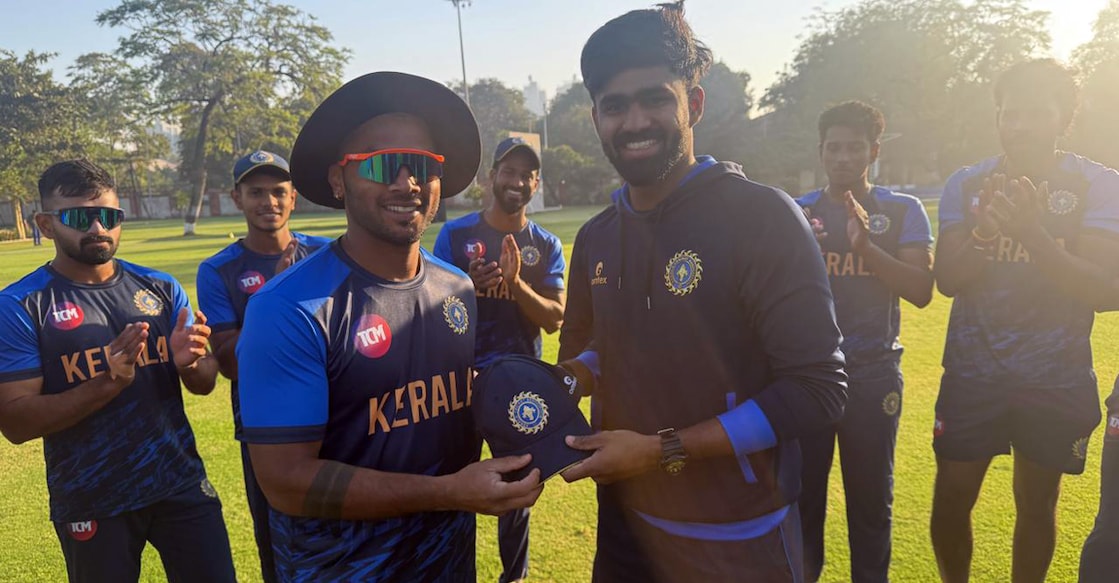 Vishnu Vinod (left) handed the maiden List-A cap for Abhishek J Nair ahead of Kerala’s Vijay Hazare Trophy opener against Tripura in Ahmedabad on December 24, 2025. Photo: KCA