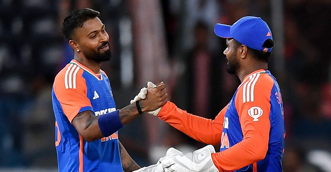 In this file photo from October 12, 2024. India's Hardik Pandya celebrates with Sanju Samson after their victory against Bangladesh in the third and final T20I at the Rajiv Gandhi International Stadium of Hyderabad. File photo: AFP/ Noah Seelam