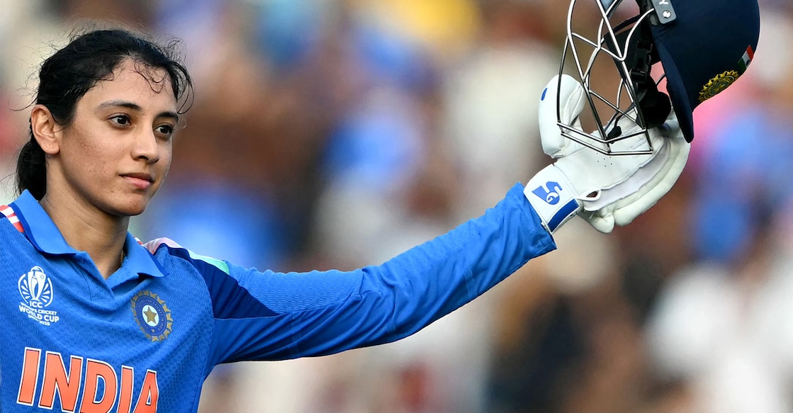 India's Smriti Mandhana celebrates after scoring a century during the ICC Women's Cricket World Cup 2025 ODI match against New Zealand at the DY Patil Stadium in Navi Mumbai on October 23, 2025. Photo: AFP/ Punit Paranjpe