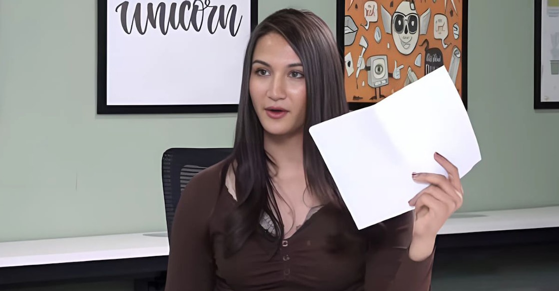 Untitled design - 1 Anaya Bangar holds up her test results. Photo: Screengrab/Instagram@anayabangar (enhanced using ai)
