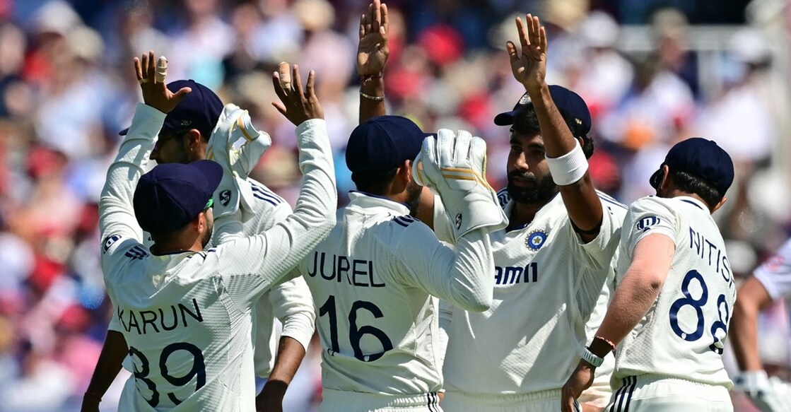 Jasprit Bumrah celebrates with teammates after bowling England's Joe Root on the second day of the third cricket test. Photo: AFP