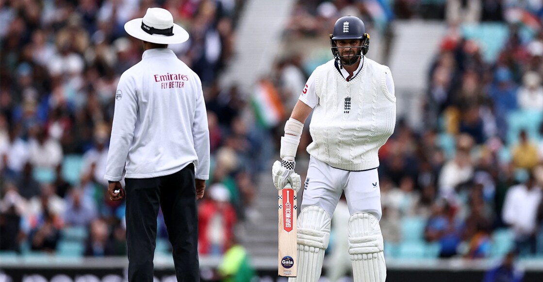England's Chris Woakes walks onto the pitch to bat on the fifth and final day of the fifth Test cricket match between England and India at The Oval in London. Photo: AFP