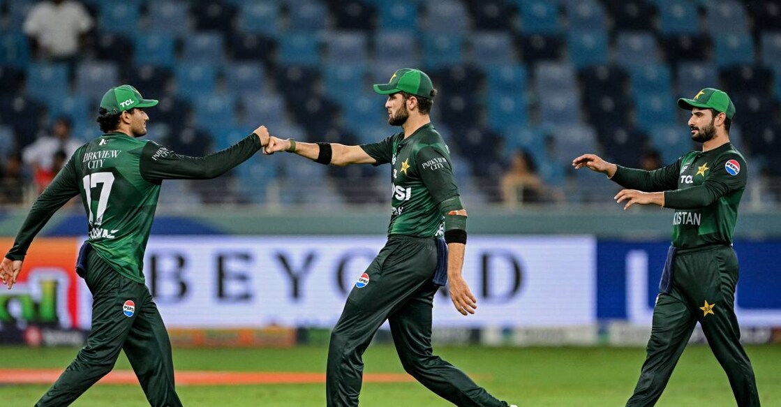 Pakistan's Shaheen Shah Afridi (C) and Hasan Nawaz (L) bump their fists to celebrate the dismissal of UAE's Asif Khan during the Asia Cup 2025 Twenty20 international cricket match between United Arab Emirates and Pakistan at the Dubai International Stadium. Photo: AFP