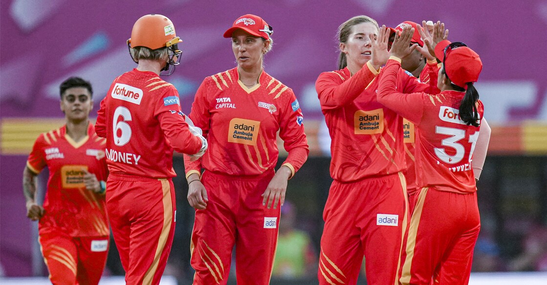 Gujarat players celebrate during the match against UP Warriorz. Photo: PTI