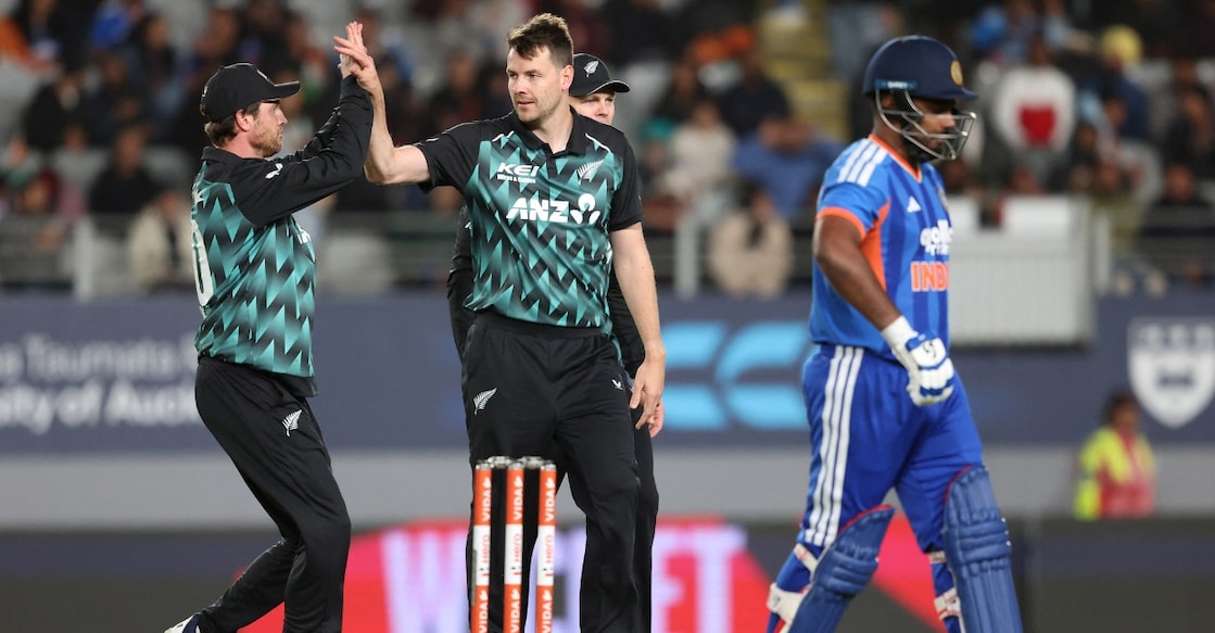 New Zealand's Jacob Duffy celebrates with teammates the wicket of India's Sanju Samson. Photo: AFP