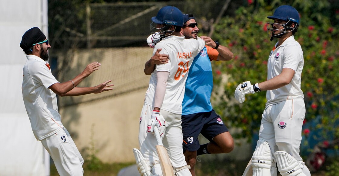 Jammu and Kashmir players celebrate after beating Bengal in the Ranji Trophy second semifinal at the Bengal Cricket Academy Ground in Kalyani on February 18, 2026. Photo: PTI