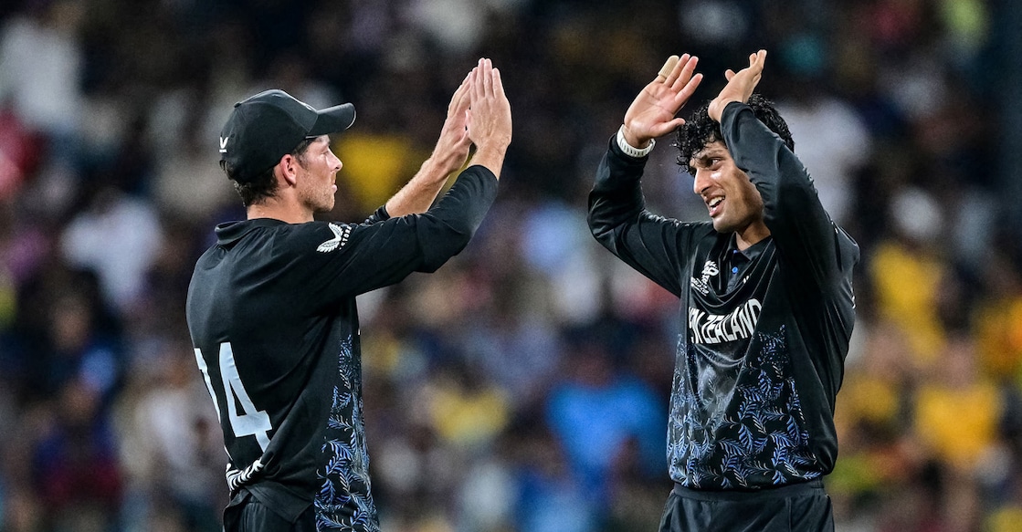 New Zealand's Rachin Ravindra (right) celebrates with captain Mitchell Santner after taking the wicket of Sri Lanka's Dushan Hemantha during the 2026 ICC Men's T20 Cricket World Cup Super Eights match at the R Premadasa Stadium in Colombo on February 25, 2026. Photo: AFP/ Ishara S Kodikara 