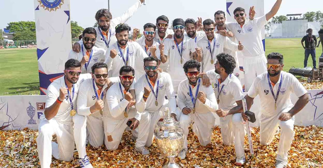 Jammu & Kashmir players pose with the trophy after winning tha Ranji Trophy final against Karnataka in Hubballi on Saturday. Photo: PTI/Shailendra Bhojak