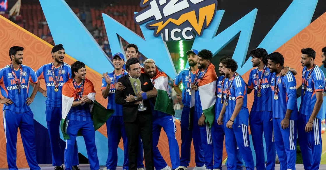 ICC Chairman Jay Shah holds the tournament trophy with India's Hardik Pandya during the presentation ceremony as teammates look on after India won the ICC Men's T20 World Cup 2026 at Narendra Modi Stadium, in Ahmedabad. Photo: PTI