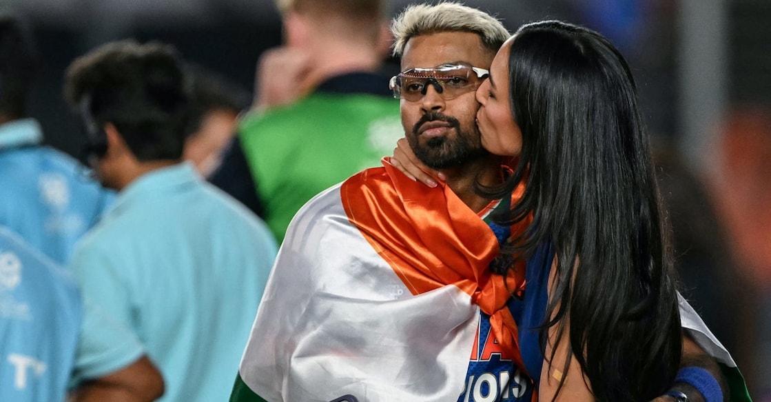 Indian cricketer Hardik Pandya along with his girlfriend and model Mahieka Sharma celebrate after India's win in the 2026 ICC Men's T20 Cricket World Cup final match against New Zealand at the Narendra Modi Stadium in Ahmedabad on March 8, 2026. Photo: AFP/ Punit Paranjpe 