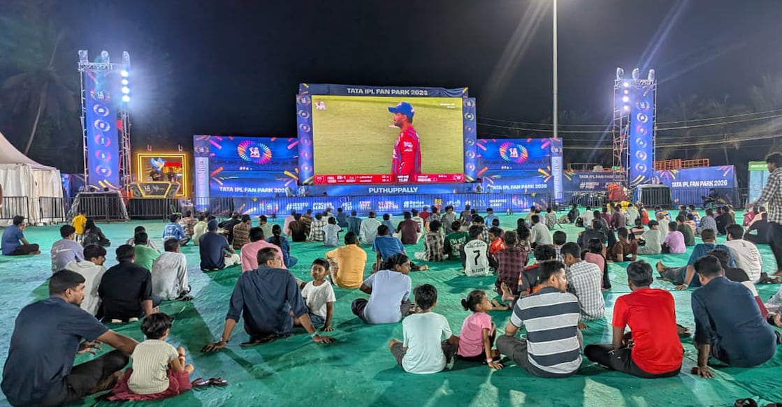Cricket lovers watch a match on a big screen at the IPL fan park at Manarcadu in Kottayam on April 19, 2026. Photo: Onmanorama