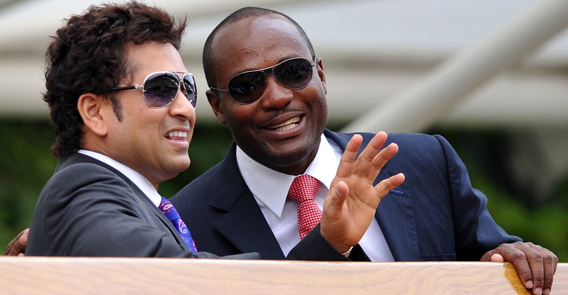 In this file photo from 2010, Sachin Tendulkar and Brian Lara watch a game at Wimbledon. File photo: AFP