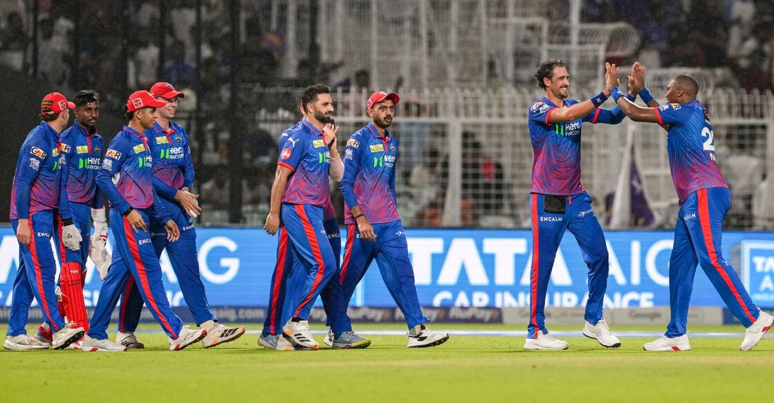 Delhi Capitals' Mitchell Starc, second right, with teammates celebrates after taking a catch of Kolkata Knight Riders' Manish Pandey. Photo: PTI/Manvender Vashist Lav