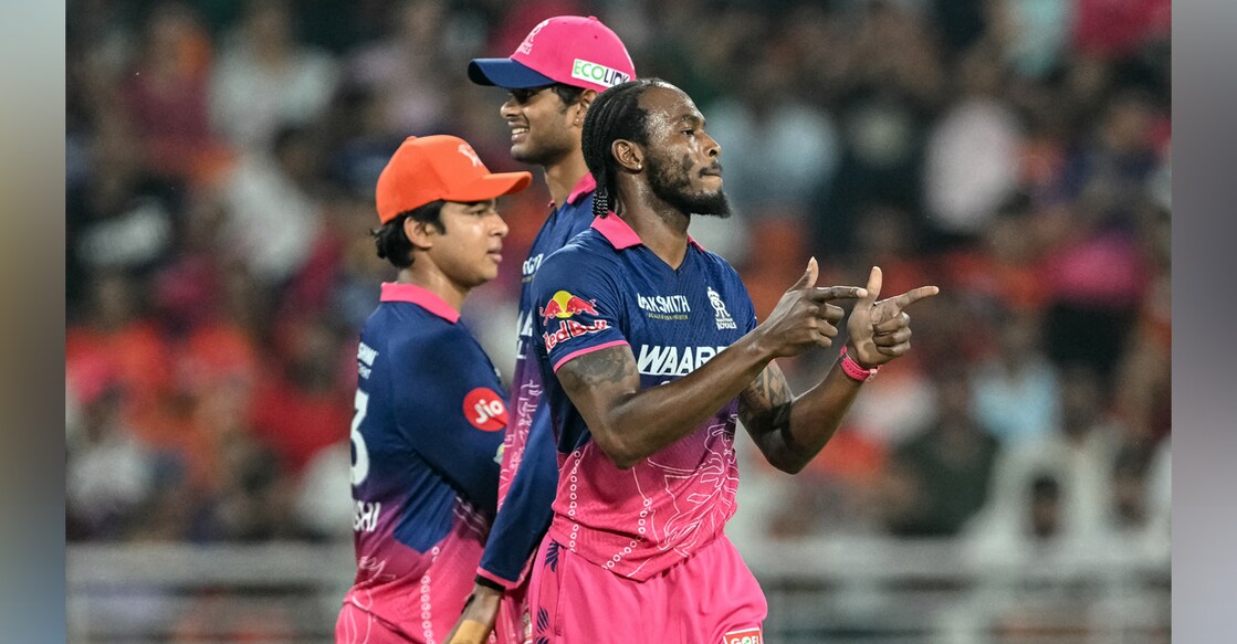 Rajasthan Royals' Jofra Archer (R) celebrates with teammates after taking the wicket of Sunrisers Hyderabad's Travis Head. Photo: AFP