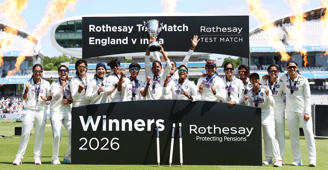 India players celebrate with the trophy after winning the one-off Test match against England. Photo: Reuters/Cat Goryn