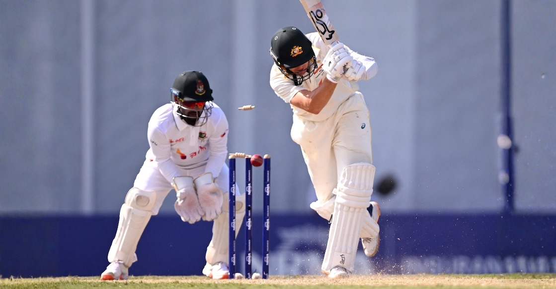 Australian batsman Marnus Labuschagne (R) is bowled as Bangladesh wicketkeeper Litton Das (L) looks on. Photo: AFP