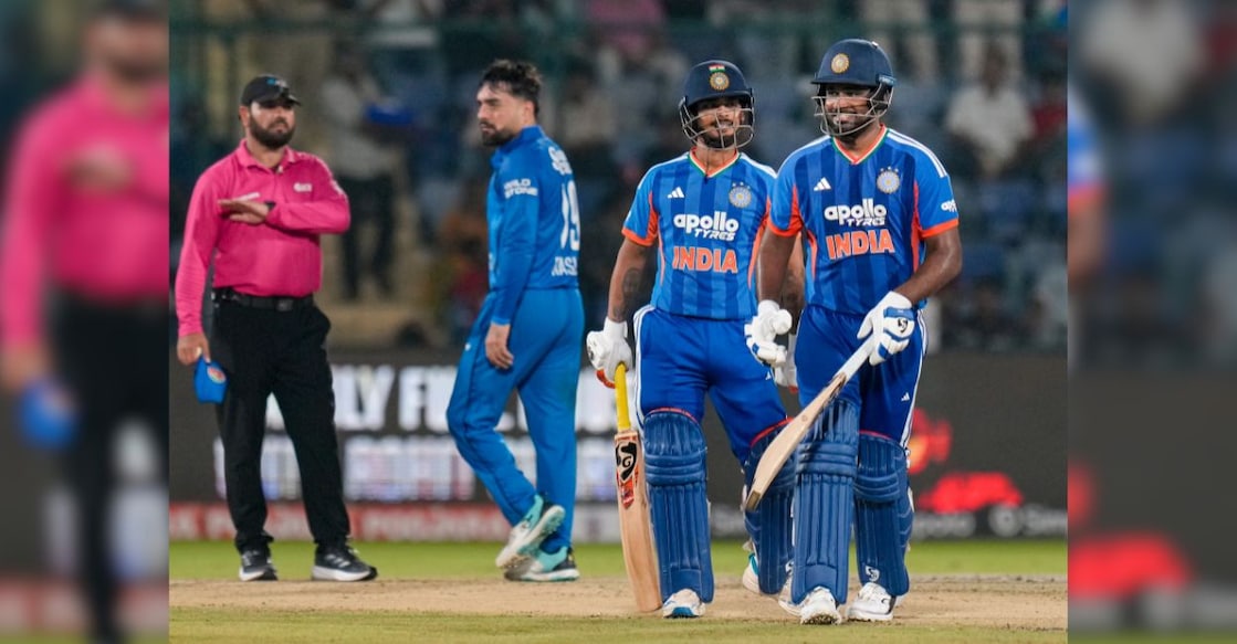 Sanju Samson, right, returns to pavilion after his dismissal by Afghanistan's Rashid Khan during the second T20I cricket match between India and Afghanistan, in New Delhi. Photo: PTI/Shahbaz Khan