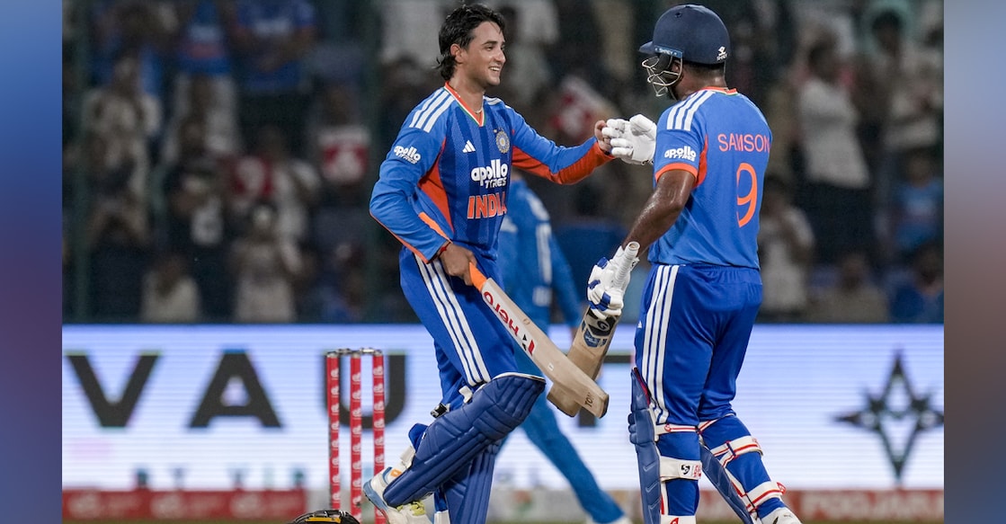  India's Abhishek Sharma reacts after his century as he celebrates with Sanju Samson, during the third and final T20I cricket match between India and Afghanistan, in New Delhi. Photo: PTI