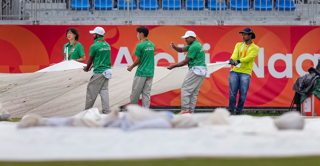 Nagoya: Ground staff cover the pitch due to rain ahead of the men's cricket Quarterfinal 2 between India and Afghanistan at the 20th Asian Games, at Korogi Athletic Park in Nagoya, Aichi Prefecture, Japan, Monday, Sept. 28, 2026. (PTI Photo/Arun Sharma)(PTI09_28_2026_000058A)