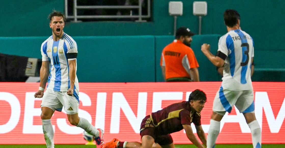 Argentina's midfielder Giovani Lo Celso (L) celebrates after scoring a goal during a friendly international football match against Venezuela. Photo: AFP