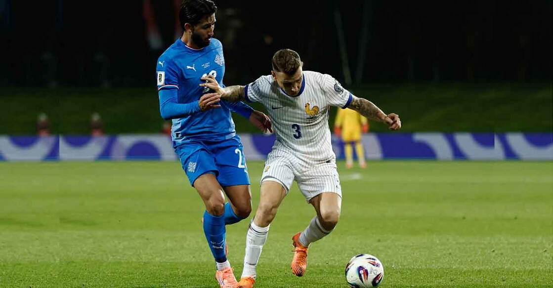 France's Lucas Digne in action with Iceland's Mikael Egill Ellertsson. Photo: REUTERS/Benoit Tessier