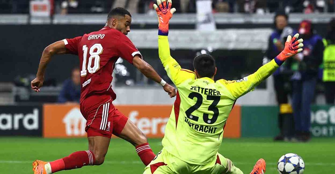 Soccer Football - UEFA Champions League - Eintracht Frankfurt v Liverpool - Deutsche Bank Park, Frankfurt, Germany - October 22, 2025  Liverpool's Cody Gakpo scores their fourth goal past Eintracht Frankfurt's Michael Zetterer REUTERS/Kai Pfaffenbach