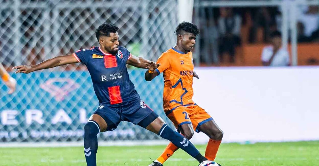 Roy Krishna (blue) of Malappuram FC in action against Thrissur Magic in a Super League Kerala match at the Payyanad Stadium in Manjeri on October 3, 2025. Photo: SLK