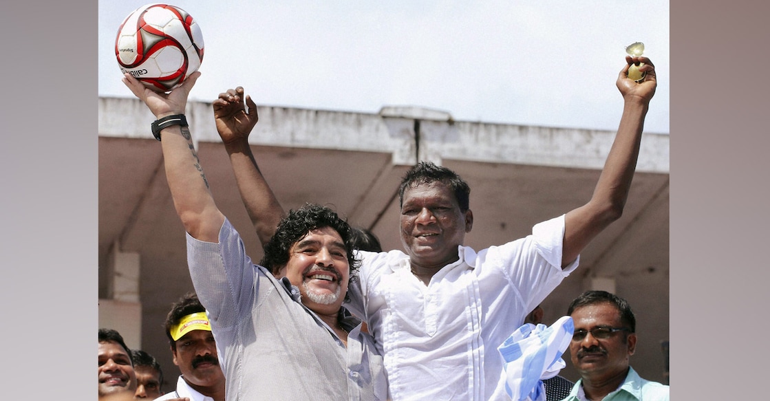Diego Maradona poses with I M Vijayan during his visit to Kannur in Kerala on October 24, 2012. File photo: PTI
