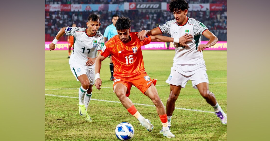 Action between India (orange) and Bangladesh in an AFC Asian Cup third round qualification match at the National Stadium in Dhaka on November 18, 2025. Photo: AIFF