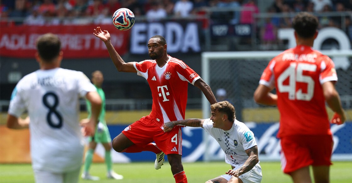 Bayern Munich's Jonathan Tah in action with Auckland City's Myer Bevan. Photo: REUTERS/Kai Pfaffenbach