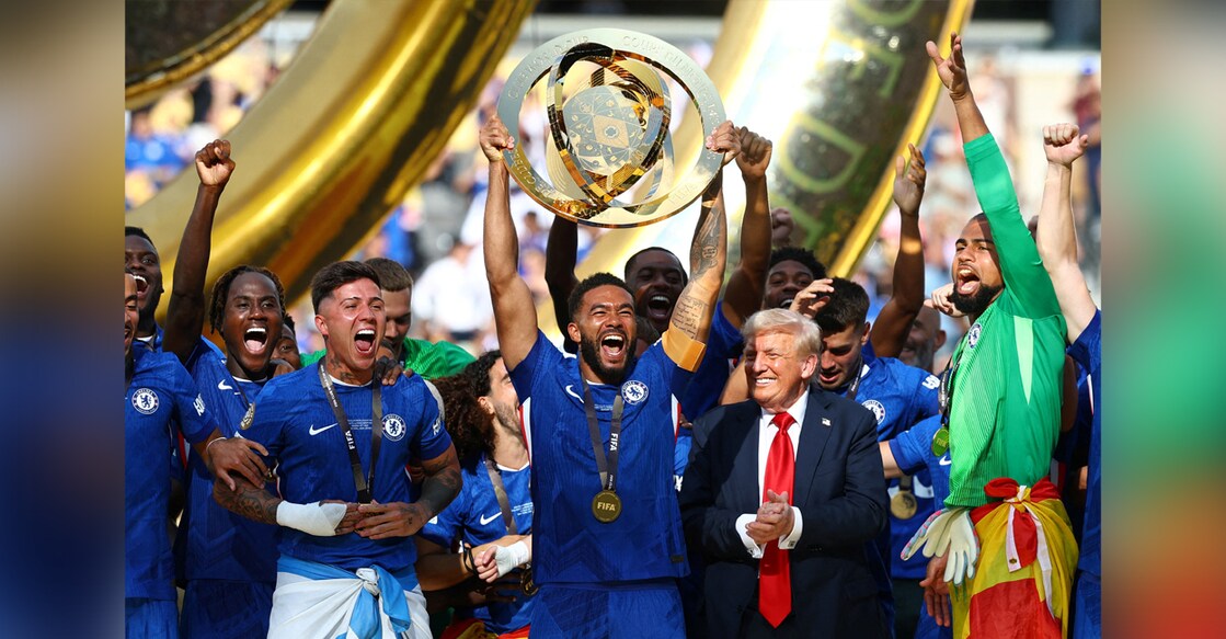 Chelsea's Reece James lifts the trophy as he celebrates with teammates after winning the FIFA Club World Cup, US President Donald Trump looks on. Photo: REUTERS/Kai Pfaffenbach