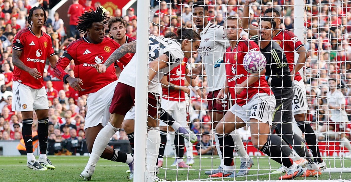 Arsenal's Riccardo Calafiori scores their first goal against Manchester United. Photo: Reuters/Jason Cairnduff
