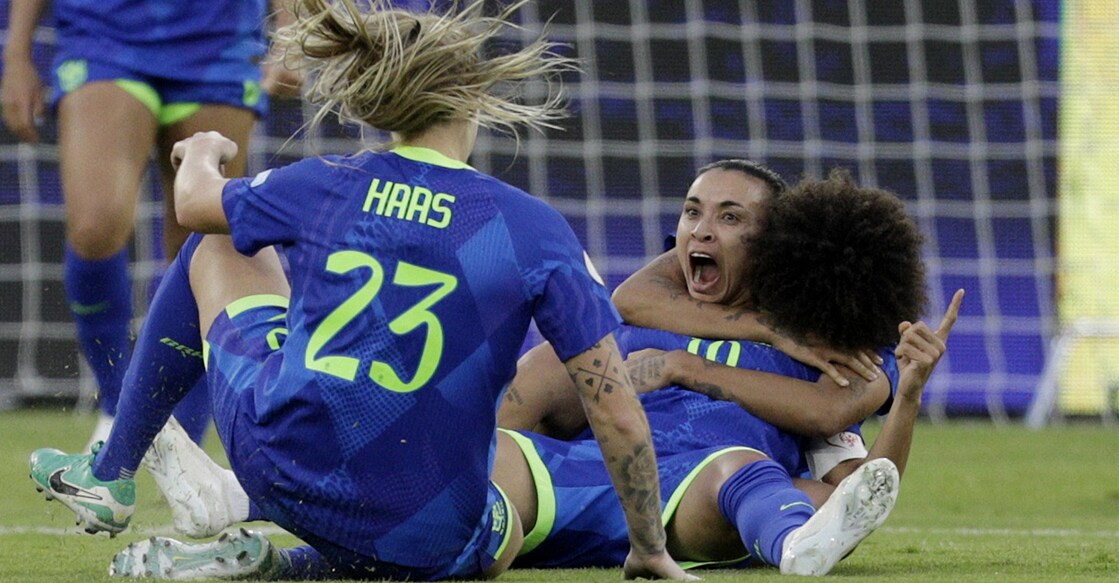Brazil's Marta celebrates scoring their third goal with teammates. Photo: Reuters