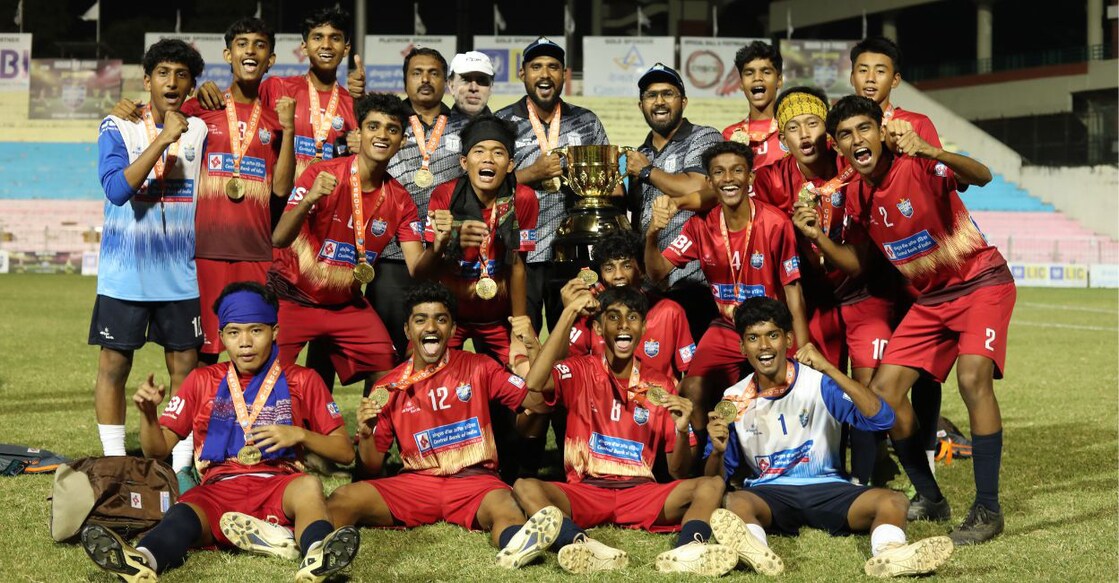 Players of Farook HSS, Kozhikode, pose with their coaches after winning the Subroto Cup in New Delhi on September 25, 2025. Photo: Special arrangement