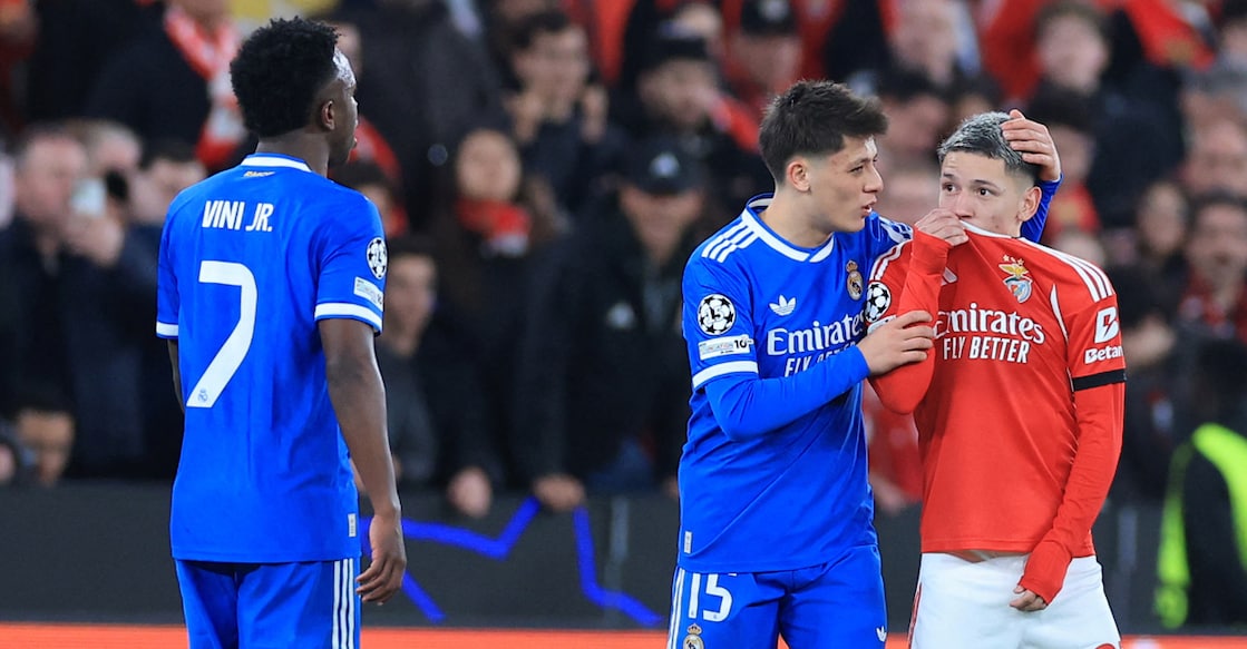 Benfica's Argentine forward Gianluca Prestianni hides his mouth while arguing with Real Madrid's Brazilian forward Vinicius Junior, who complained about alleged racist insults during the UEFA Champions League knockout round play-off first leg football match at Estadio da Luz in Lisbon on February 17, 2026. Photo: AFP/ Patricia de Melo Moreira 