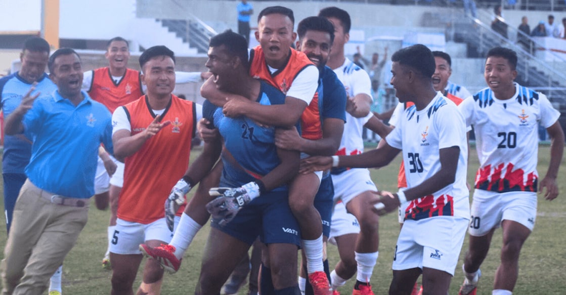 Goalkeeper Muhammed Shanoos PP is surrounded by his Services’ teammates after a penalty shootout win over West Bengal in the quarterfinals of the 79th Santosh Trophy at the Dhakuakhana Football Stadium in Assam on February 3, 2026. Photo: AIFF