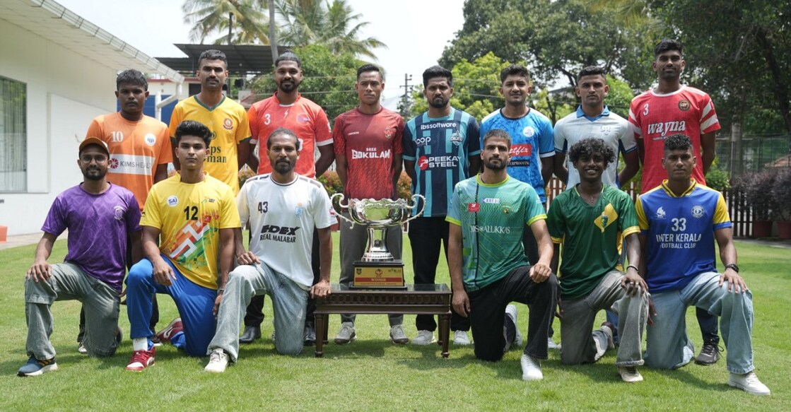 Captains of the 14 clubs participating in the 13th edition of Kerala Premier League pose next to the trophy in Kochi on March 2, 2026. Photo: Special arrangement