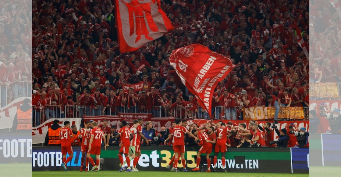 Bayern Munich's Michael Olise celebrates scoring their fourth goal with teammates and fans. Photo: Reuters