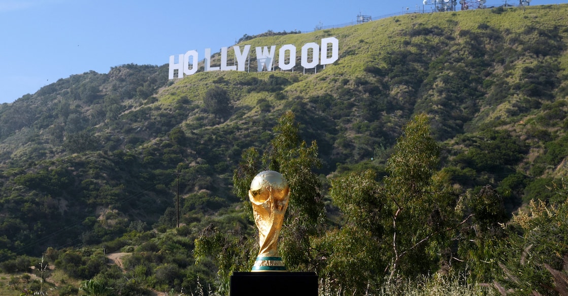 The FIFA World Cup trophy is displayed near the Hollywood sign on March 23, 2026 in Hollywood, California. Photo: Presley Ann/Getty Images via AFP