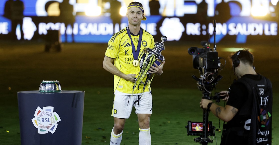 Al Nassr's Cristiano Ronaldo celebrates with the trophy after winning the Saudi Pro League. Photo: REUTERS/Hamad