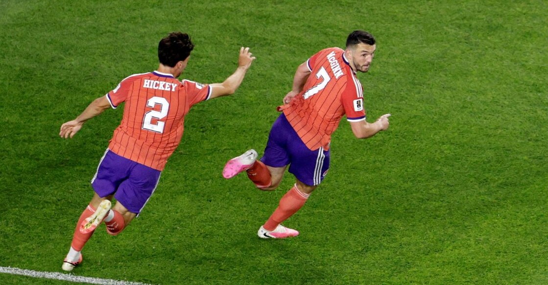 Scotland's John McGinn celebrates scoring their first goal with Aaron Hickey. Photo: Reuters.