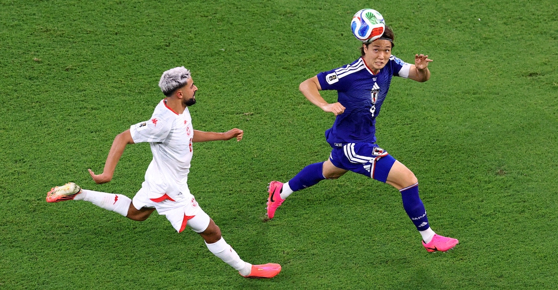 Japan's Kou Itakura in action with Tunisia's Elias Saad during a FIFA World Cup group match. Photo: Reuters/Raquel Cunha