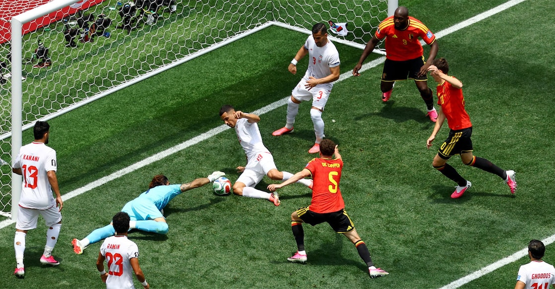 Belgium's Nathan Ngoy is shown a red card by referee Dario Herrera. Photo: Reuters/Kirby Lee