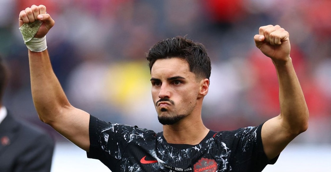 Canada's Stephen Eustaquio celebrates after the match as Canada qualify for the round of 16 stage of the World Cup. Photo: Reuters. 