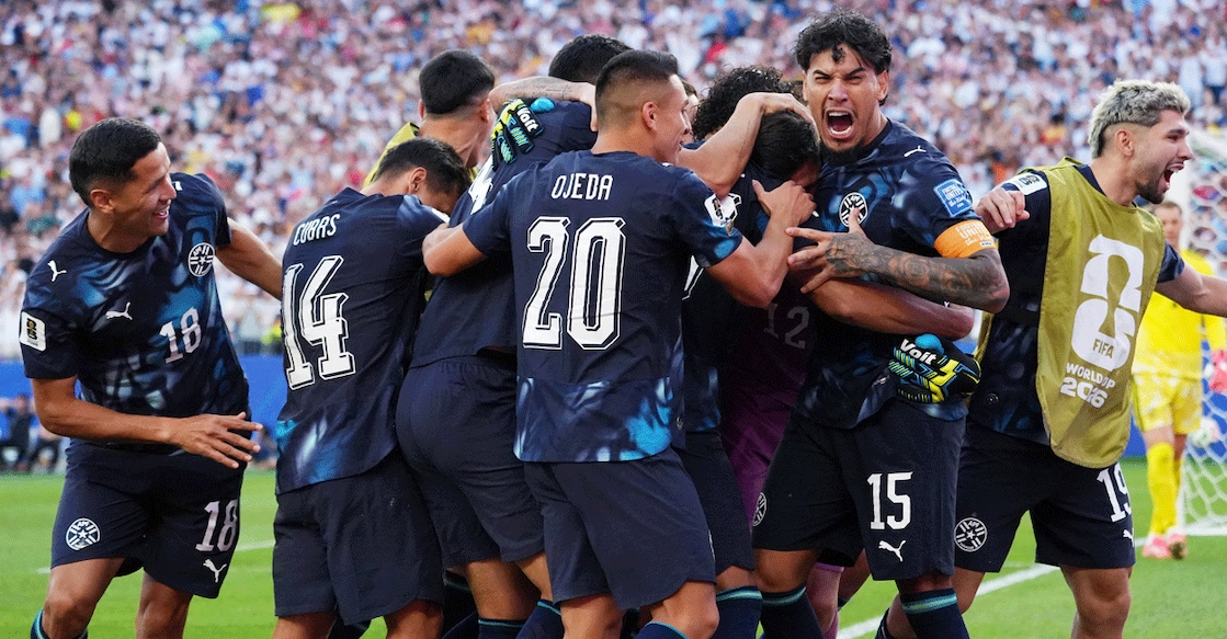 Paraguay's Gustavo Gomez and teammates celebrate winning the penalty shootout against Germany in the round of 32 of the FIFA World Cup. Photo: Reuters/David Butler Ii