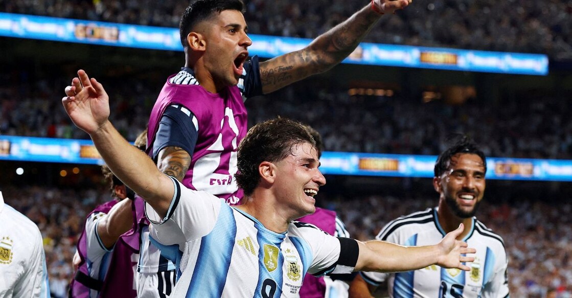 Argentina's Julian Alvarez celebrates scoring their second goal with Cristian Romero. Photo: REUTERS/Agustin Marcarian