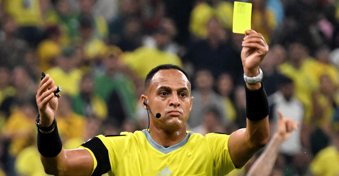 In this file photo from the 2022 FIFA World Cup, US referee Ismail Elfath shows a yellow card during a match between Cameroon and Brazil at the Lusail Stadium in Doha. File photo: AFP/ Issouf Sanogo 
