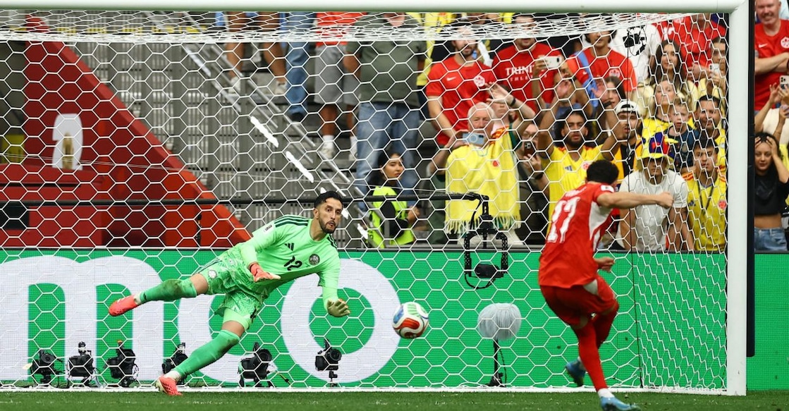 Switzerland's Ruben Vargas scores a penalty past Colombia's Camilo Vargas to win the penalty shootout. Photo: Reuters