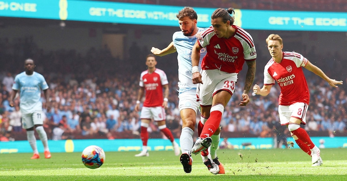 Arsenal's Riccardo Calafiori scores their first goal. Photo: Reuters